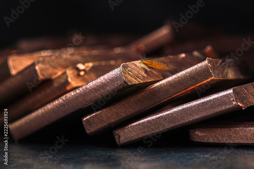 Copper Ingots in a Row in a Dark Industrial Setting