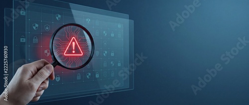 Hand holding magnifying glass over glowing red warning sign on digital interface, security alert, data analysis, threat detection, system error, cybersecurity concept