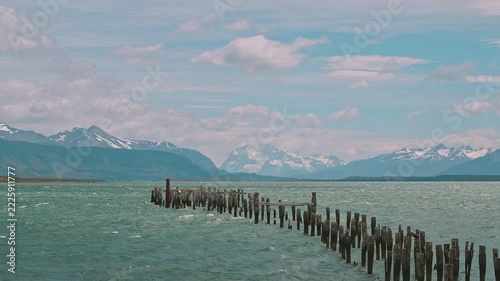 Old abandoned pier in the sea near Torres del Paine shot in parallax slow motion, Peurto Natales, Chile