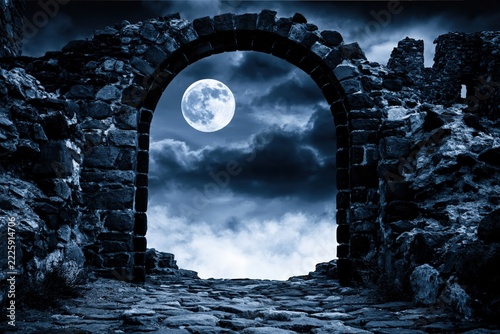 Ancient stone archway opens to a moonlit night sky.