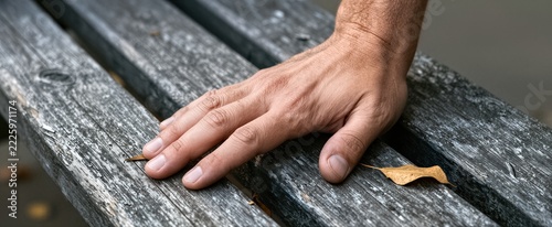 Captures Close Of Human Hand Resting On Weathered Wooden Bench To Belong Adult With Signs Aging As Wrinkles Slightly Aged Skin Texture