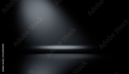 Dark black studio stage background with spotlight beam and reflection on floor