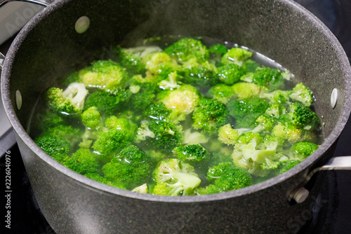 Green Broccoli Florets Boiling in a Pot of Water