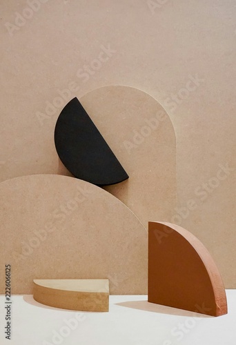 Fotografie Minimalist geometric product display composition with terracotta beige and black