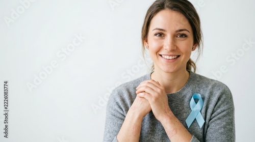 Woman Smiling with Blue Ribbon Awareness Symbol for Prostate Cancer or Male Health