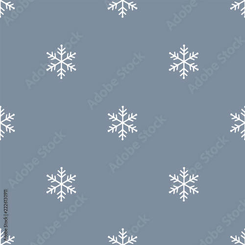 Cute White Snowflake Winter Seamless Pattern. Simple hand drawn snow crystal repeat pattern on muted blue grey background.