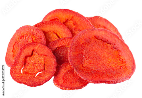 Crispy roasted carrot chips with sea salt, isolated on white background. Healthy and crunchy natural vegetable snack. Clipping path.