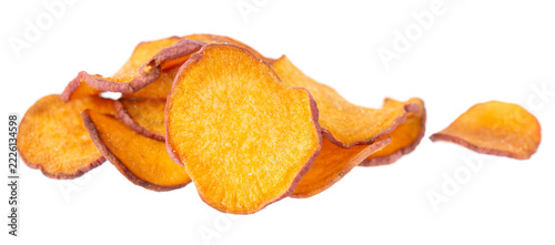 Crispy roasted sweet potato chips with sea salt, isolated on white background. Healthy and crunchy natural vegetable snack. Clipping path.