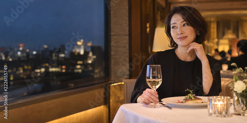 Woman dining in an understated hotel restaurant