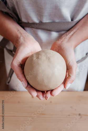 Pottery Making Process. Female Potter Working with Clay in Ceramic Workshop