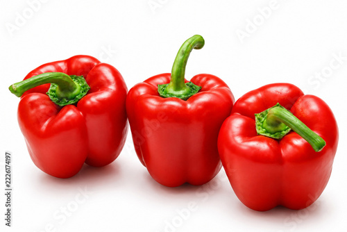 Three Fresh Red Bell Peppers Isolated on White Background