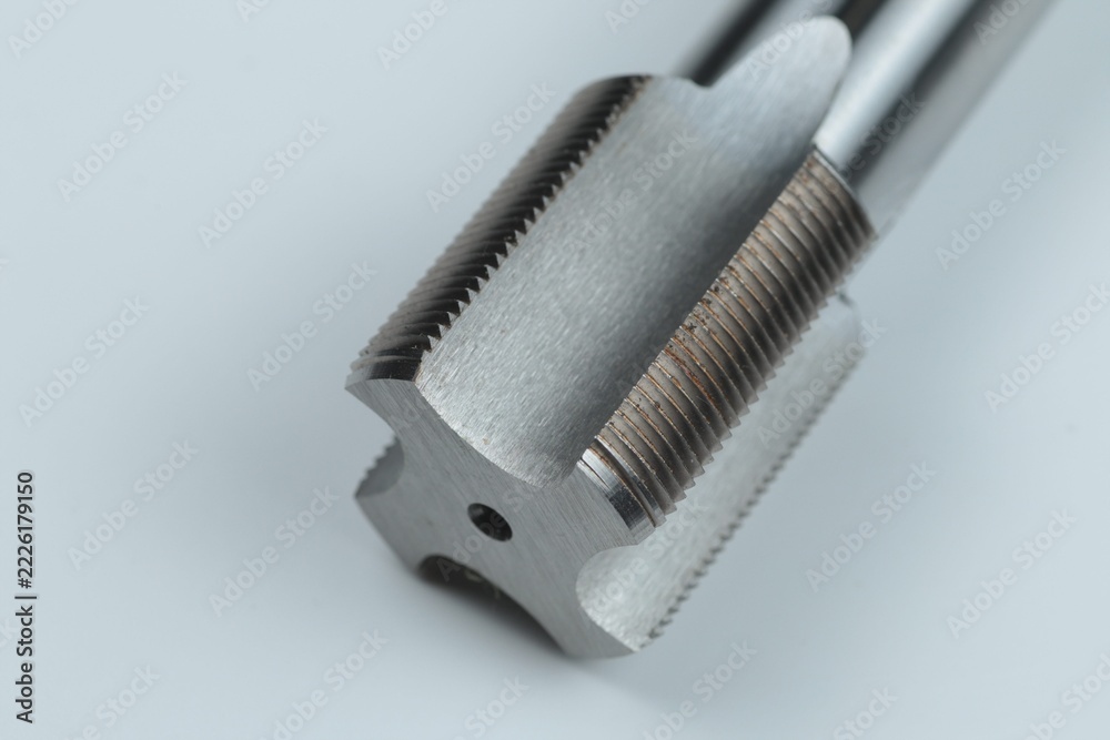 Fototapeta premium a metal-cutting tool designed for cutting or restoring internal threads in pre-drilled holes