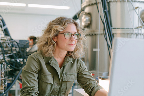 Female Quantum Lab Technician Working with Advanced Equipment