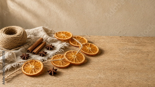 Dried orange slices cinnamon sticks and star anise handmade autumn garland craft flatlay