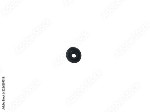 Black plastic grommet with smooth finish isolated