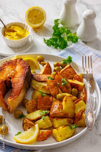 Portuguese grilled salmon steak on a plate