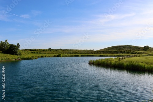 The quiet lake in the park on a sunny day.