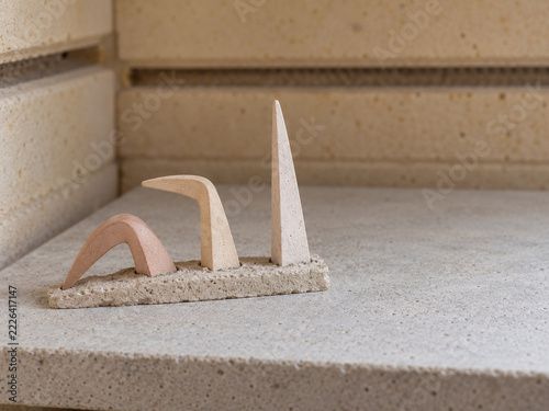 Minimalist abstract stone sculpture in beige and pink tones
