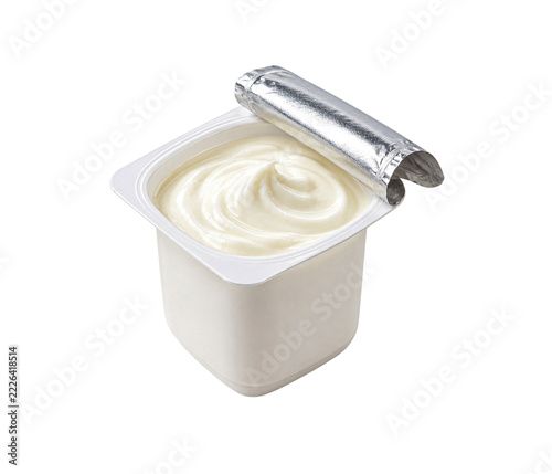 Open plastic cup of fresh plain white yogurt isolated on a clean white background