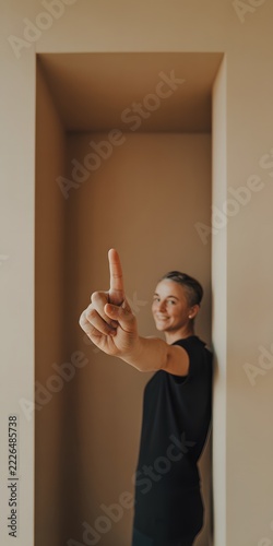 Person pointing with an index finger in an expressive gesture directing attention and indicating a direction for communication and promotional concepts with a bold visual emphasis on the hand movement