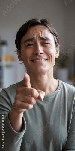 Person pointing with an index finger in an expressive gesture directing attention and indicating a direction for communication and promotional concepts with a bold visual emphasis on the hand movement