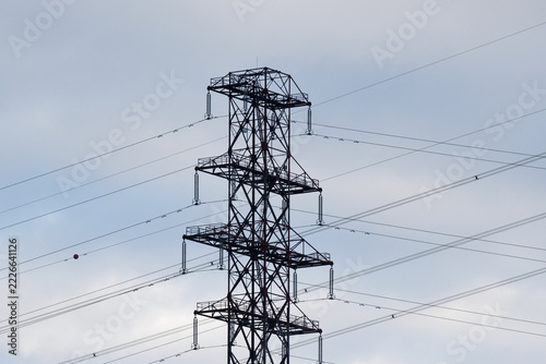 electricity pylon under a blue sky