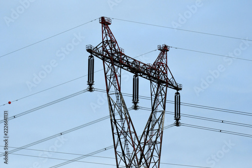 electricity pylon under a blue sky