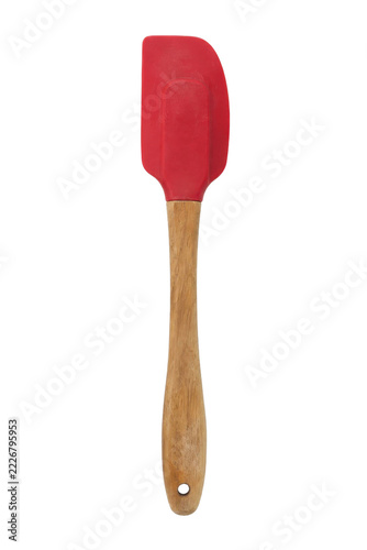 Fotografie Vibrant red silicone spatula with a natural wooden handle is positioned vertical