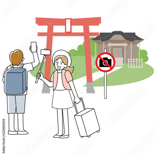 撮影禁止場所で写真撮影をする観光客