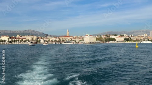 Split to Trogir by Water Taxi, Croatia. A view from a water taxi travelling from Split to Trogir, featuring a panoramic view of Split’s waterfront and the historic Diocletian’s Palace. The Adriatic Se