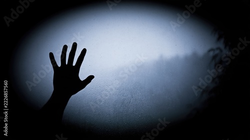 Haunted gesture: paranormal. Halloween. Hand's silhouette
