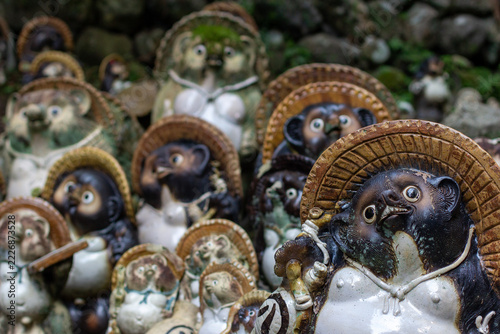 Collection of Traditional Tanuki Pottery Figurines at a Buddhist Temple in Kyoto, Japan