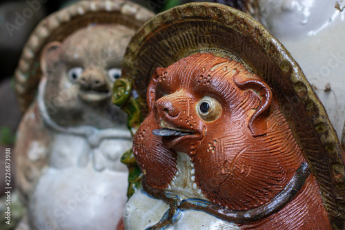 Close-Up of a Ceramic Tanuki Figurine with Yen Coins in Its Mouth, Kyoto, Japan