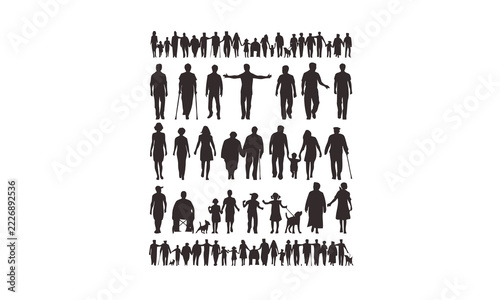 Large group of silhouetted people standing together in a crowd formation