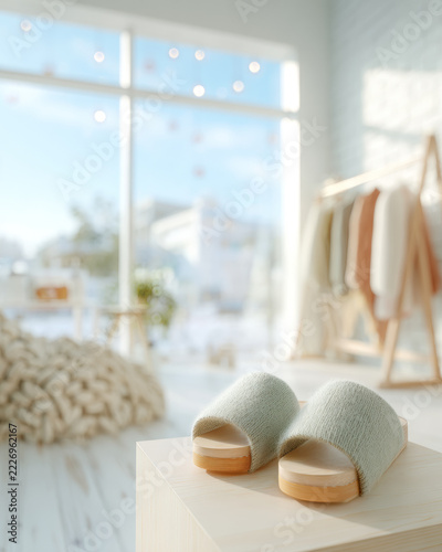 Cozy knit slippers on a wooden block in a bright Scandinavian apartment interior