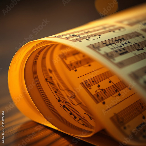 Old sheet music. Scrolls of antique sheet music lie on the table