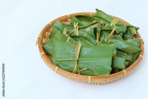 Moochi Leaf Parcels in a Bamboo Basket from a Low Angle