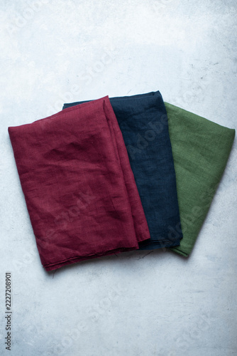 Burgundy Navy Blue and Sage Green Linen Fabrics Flat Lay