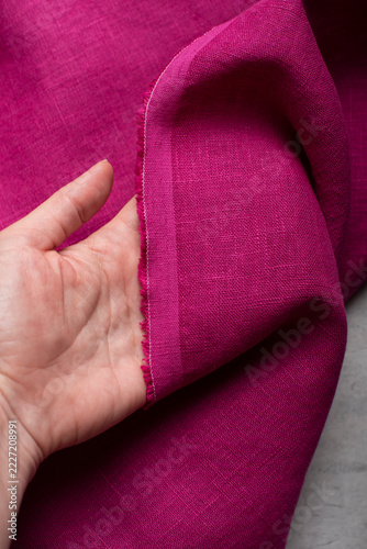 Hand Holding Raw Edge Fuchsia Pink Linen Fabric