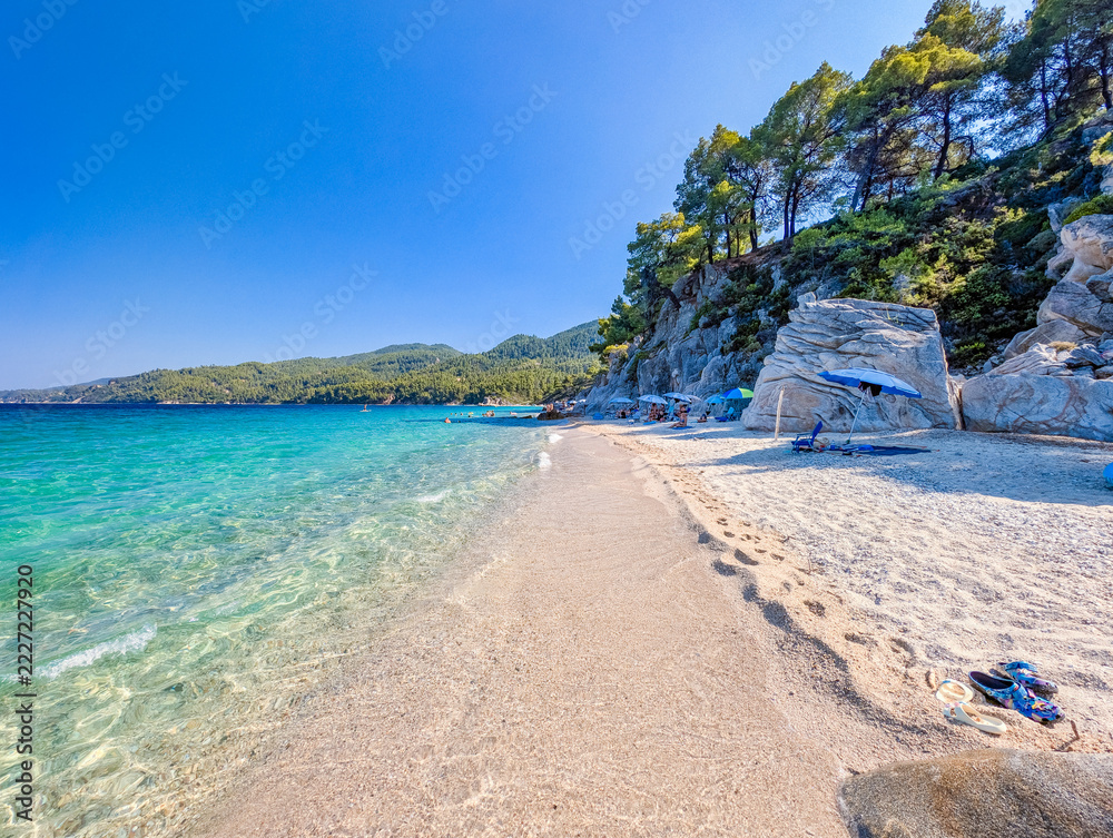 Fotografie Clear water lapping a sandy shore, Sithonia
