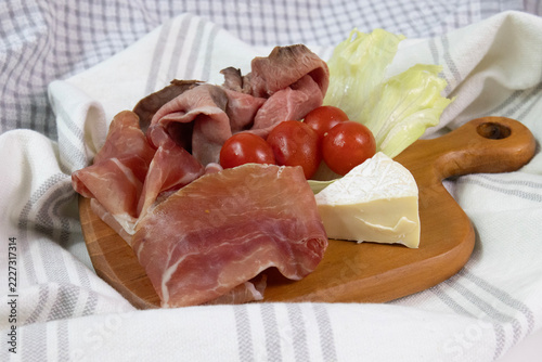 Cold Cut, Parma Ham , Platter with Cured Meats, Camembert, and Cherry Tomatoes