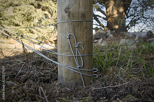Obraz na plátně Fence post showing detailed wire work for tensioned fence wire termination using