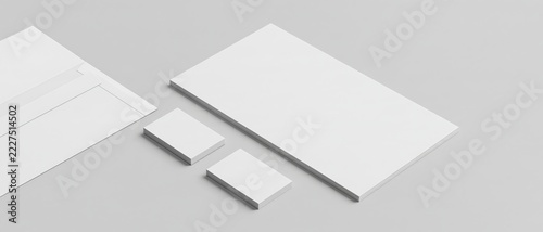 Plain white stationery items are arranged on a neutral background.