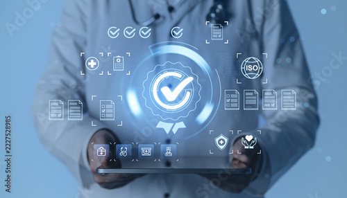 Fotografie Medical quality assurance and healthcare compliance certification with digital checkmarks, documents, ISO standards, and clinical technology background
