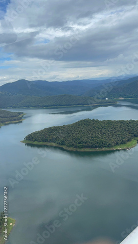 Obraz na plátně Forested landform and shoreline in a mountain reservoir