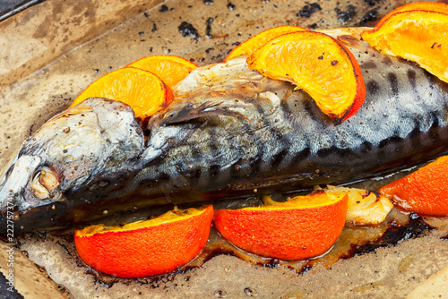 Homemade roasted mackerel with mandarin slices
