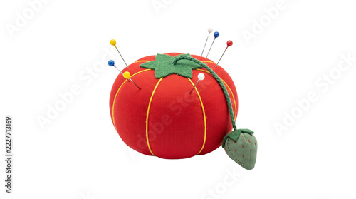 Vintage red tomato pincushion with colorful sewing pins, classic fabric pin cushion for dressmaking, traditional sewing notions and tailoring tools isolated PNG with Transparent Background