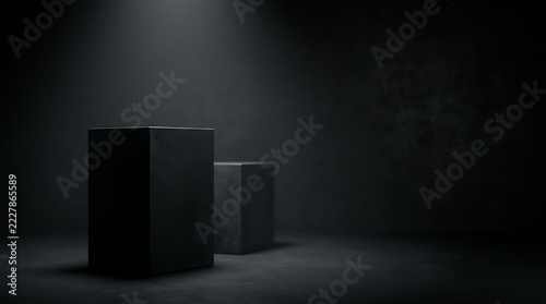Dark minimalist studio background featuring two metallic podiums illuminated by dramatic top spotlight.