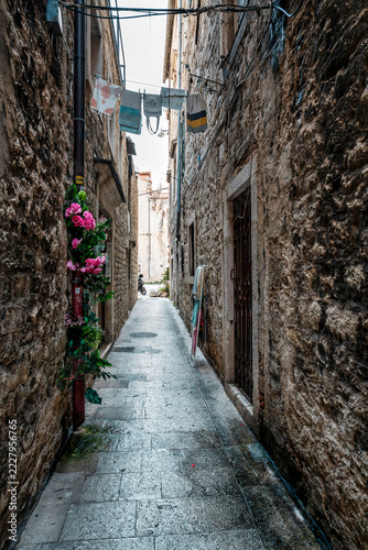 Narrow Historic Stone Alley with Hanging Laundry in Split Croatia Old Town
