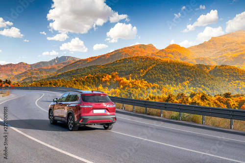 Obraz na plátně car drive on autumn road in beautiful nature